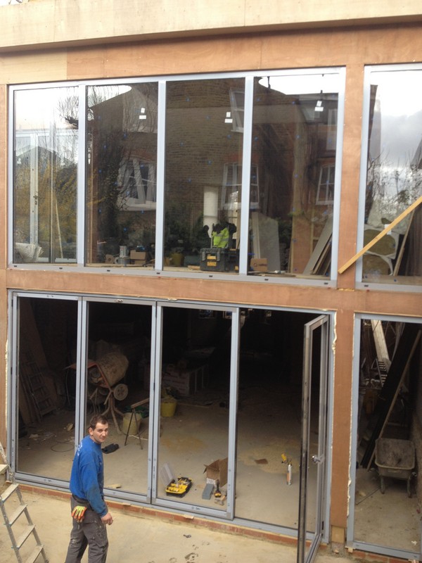 Aluminium bi-fold doors with two-storey glazing in West Ealing